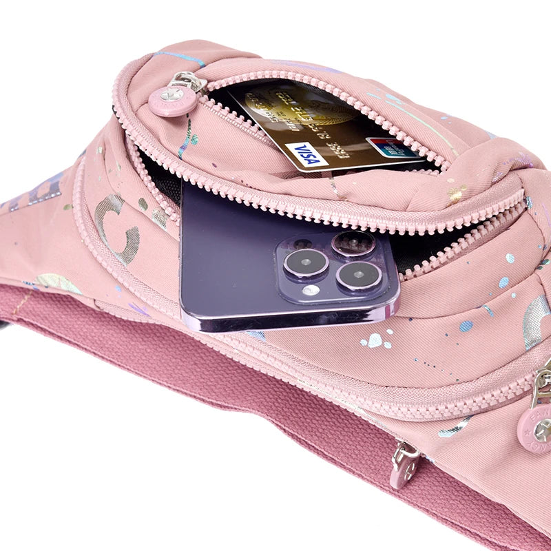 Pink waist bag with phone and card compartments on a white background