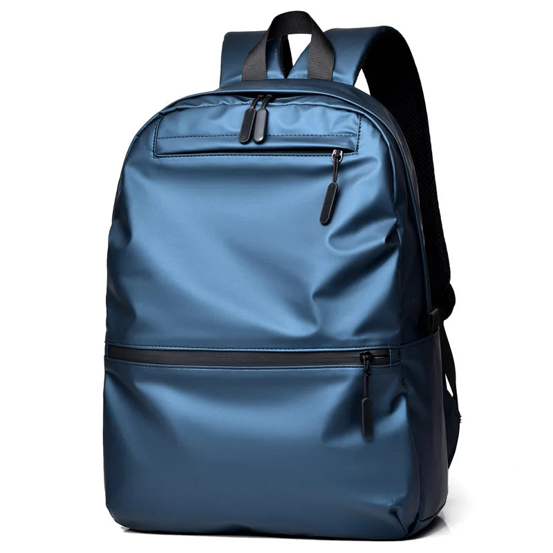 Stylish blue waterproof backpack with spacious compartments for laptops and essentials.