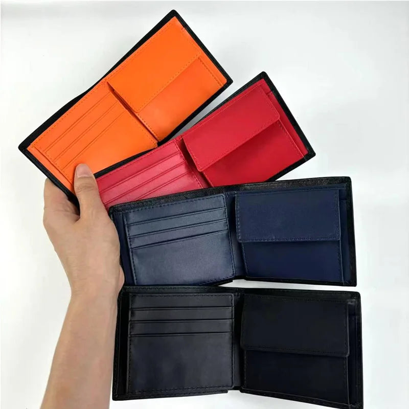 Hand holding open wallets in orange, red, and black on a white background