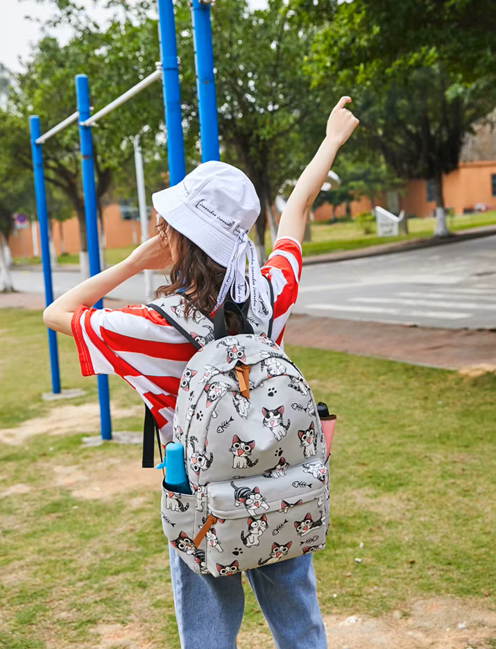 Person with a patterned backpack on a playground