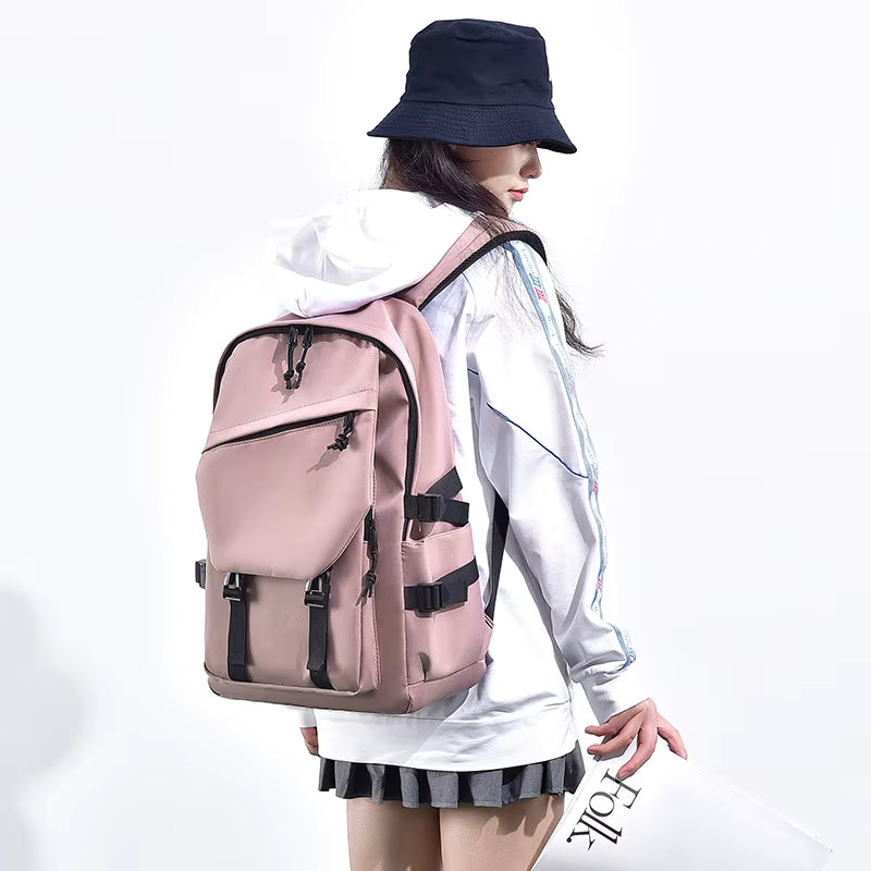 Person wearing a pink backpack with black straps on a white background