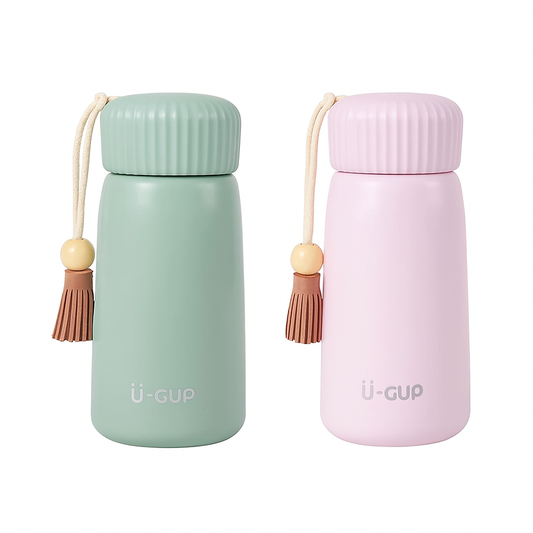 Two insulated bottles, one green and one pink, with tassels on a white background.