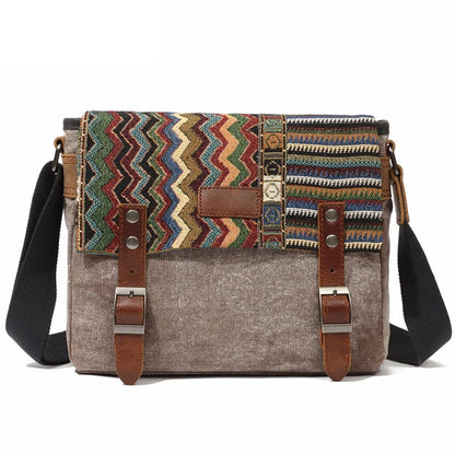 Canvas handbag with colorful zigzag pattern and brown straps on a white background