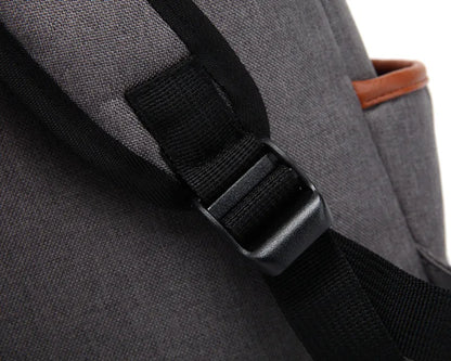 Gray backpack with black strap on a white background