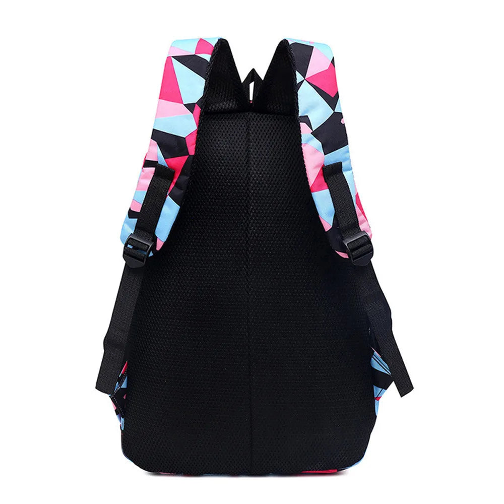Black backpack with colorful geometric pattern on straps against a white background