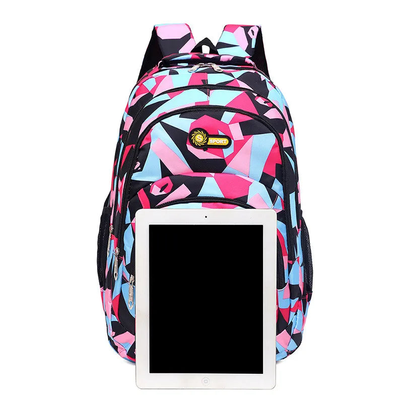 Colorful geometric-patterned backpack with a tablet pocket on a white background