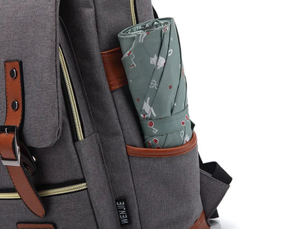 Gray backpack with a patterned pouch on a white background