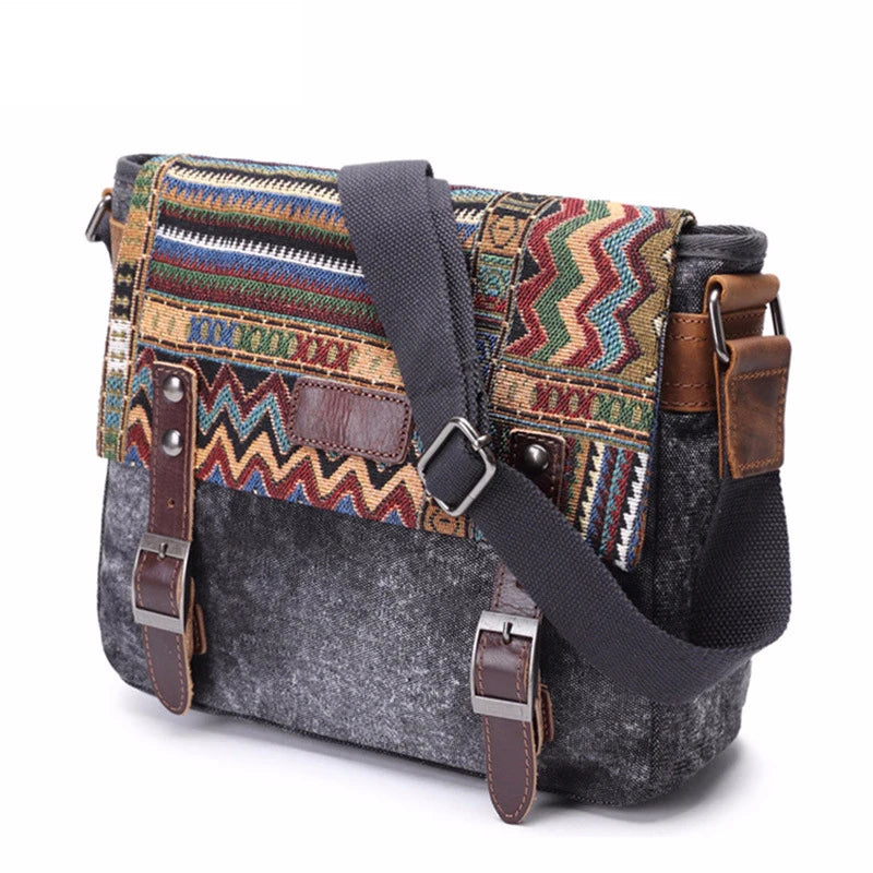 Multicolored patterned bag with gray base and brown leather straps on a white background