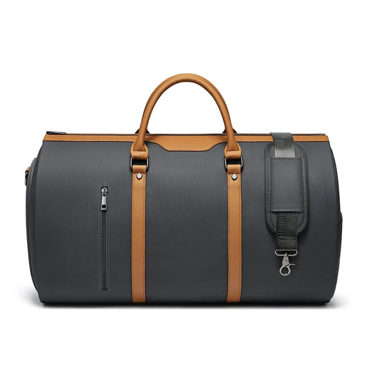 Black duffel bag with brown straps and accents on a white background