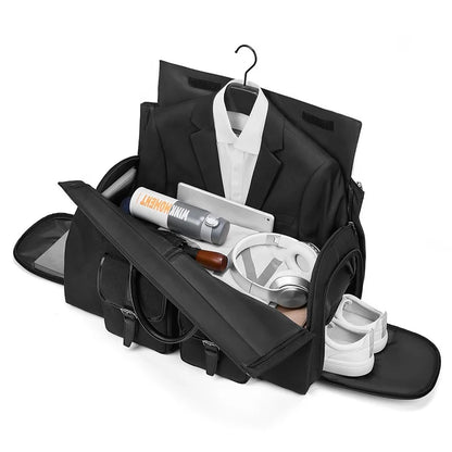 Black travel bag with a suit, shoes, and grooming items on a white background