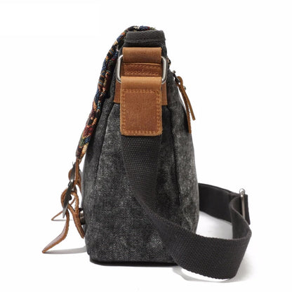 Gray shoulder bag with a patterned strap on a white background