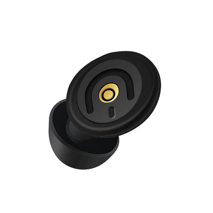 Black rubber door stopper with gold center on a white background