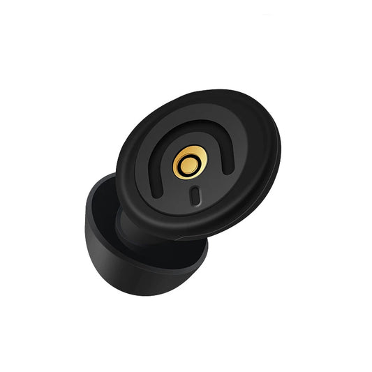 Black rubber door stopper with gold center on a white background
