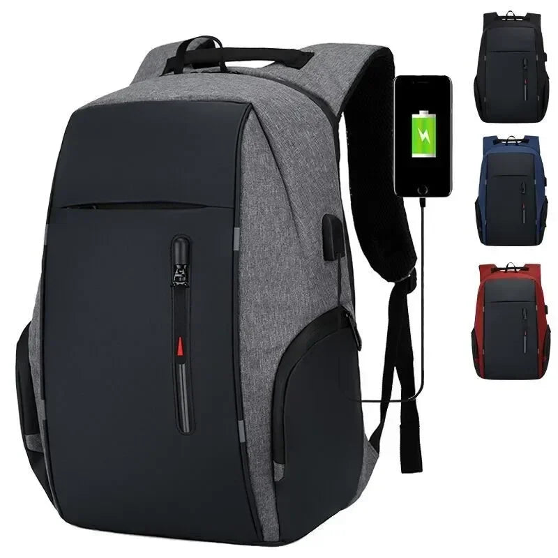 Gray and black backpack with USB port, phone showing battery icon, and additional backpacks in corner.