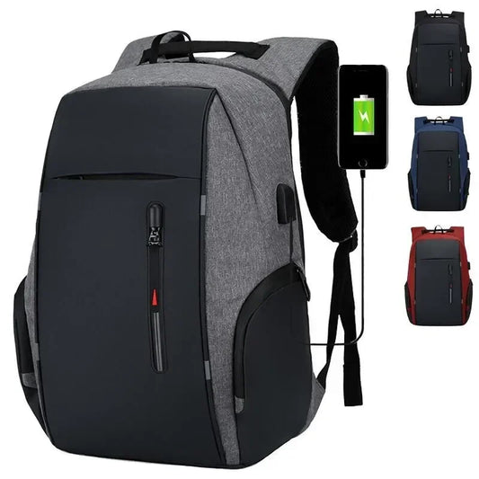 Gray and black backpack with USB port, phone showing battery icon, and additional backpacks in corner.