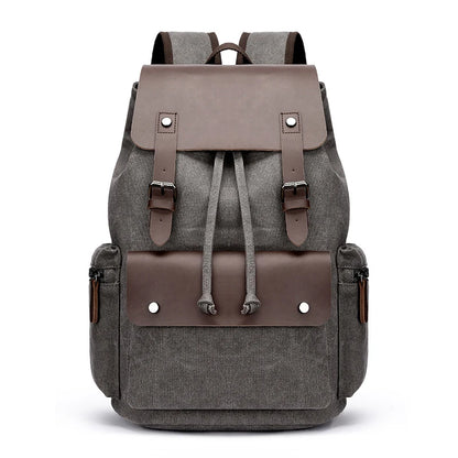 Gray backpack with brown leather accents on a white background