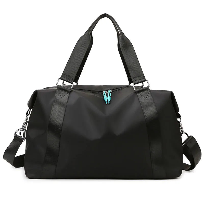 Black handbag with a strap on a white background