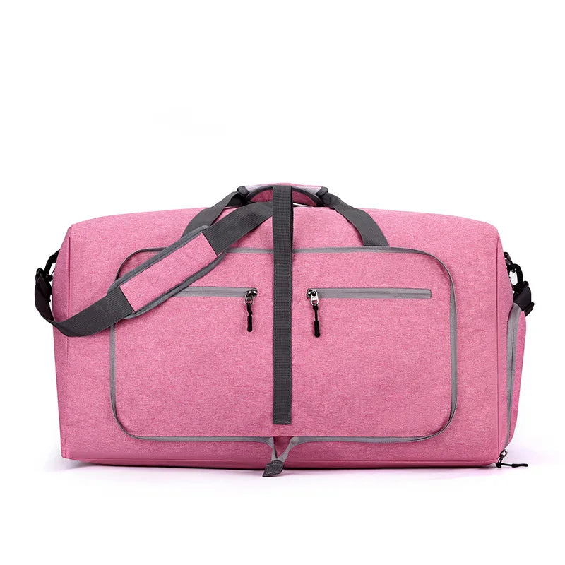 Pink duffel bag with black straps on a white background