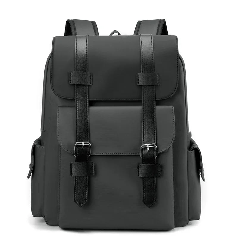 Black backpack with leather straps on a white background