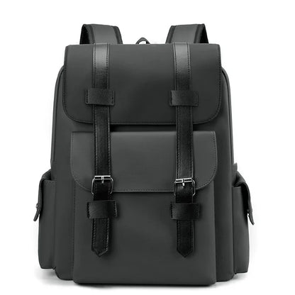 Black backpack with leather straps on a white background