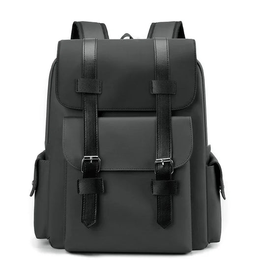 Black backpack with leather straps on a white background
