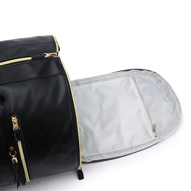 Black bag with gold zippers on a white background