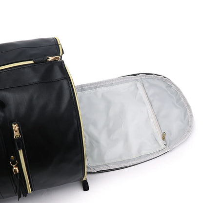 Black bag with gold zippers on a white background