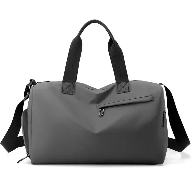 Gray duffel bag with black straps on a white background