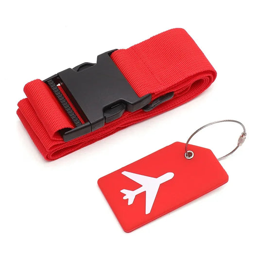 Red luggage strap with black buckle and red tag with airplane symbol on a white background