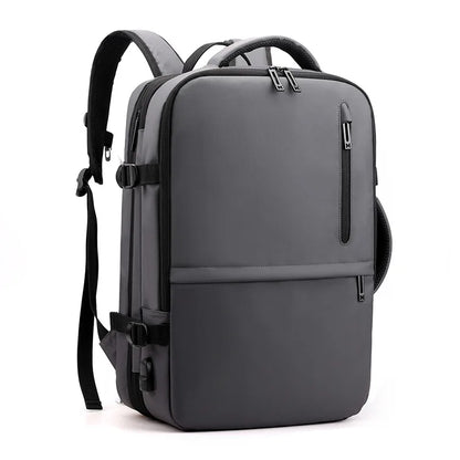Gray backpack with multiple pockets and straps on a white background