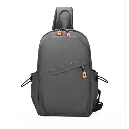Gray backpack with orange zippers on a white background