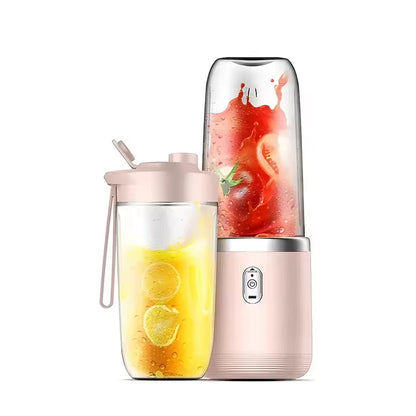 Portable blender with a clear container filled with lemon slices and a pink lid on a white background.