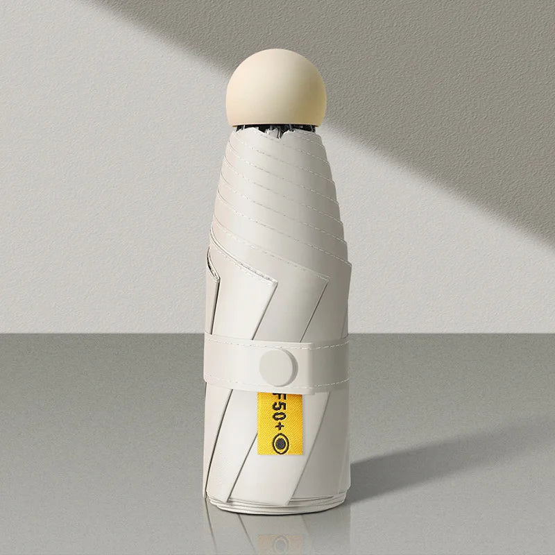 White cylindrical object with a yellow label on a gray background