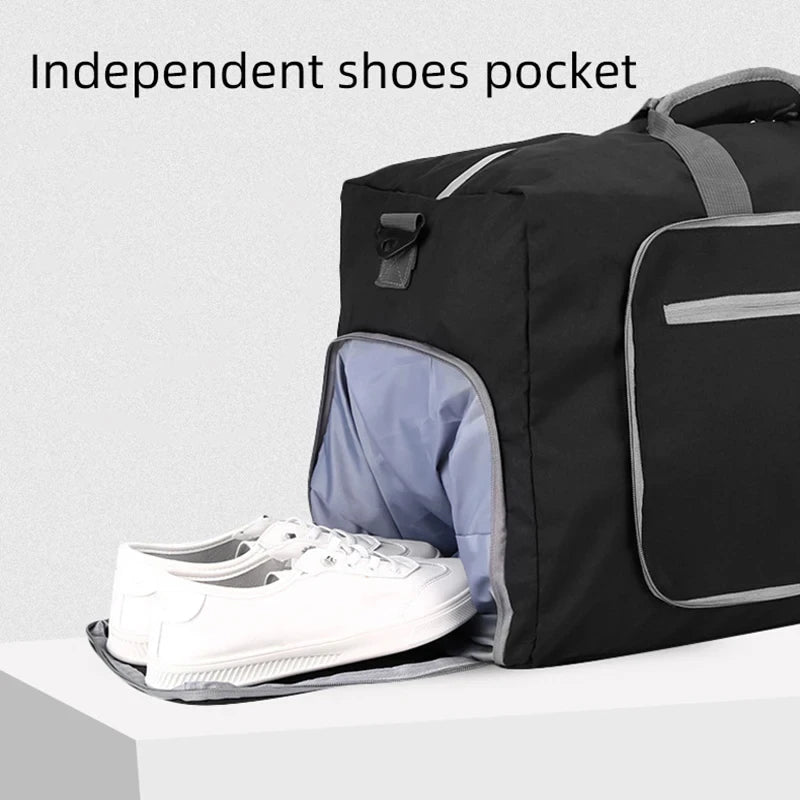 Black duffel bag with an open section for shoes on a light gray background