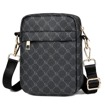 Black patterned crossbody bag with gold accents on a white background