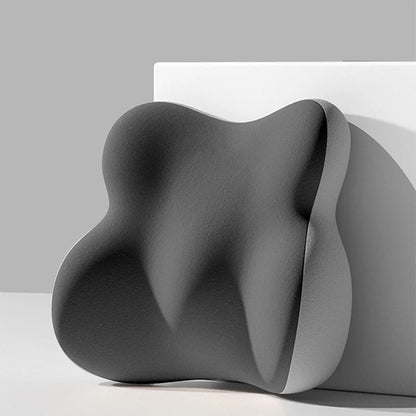 Modern, wavy gray sculpture on a neutral background