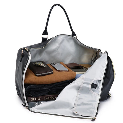 Black duffel bag with compartments containing books and a wallet on a white background