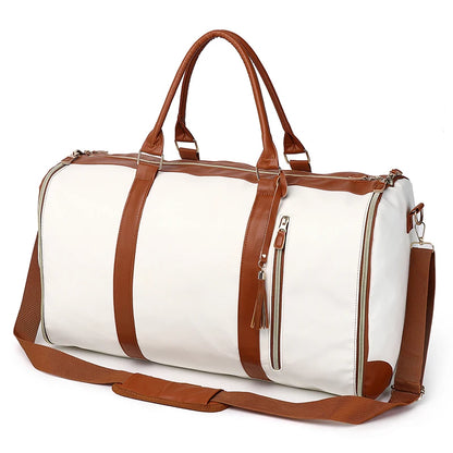 White duffel bag with brown leather straps and trim on a white background