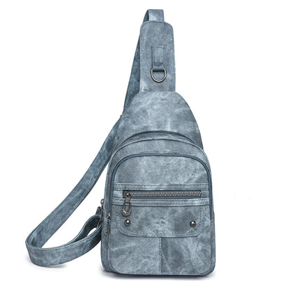 Gray suede sling bag on a white background