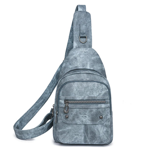 Gray suede sling bag on a white background
