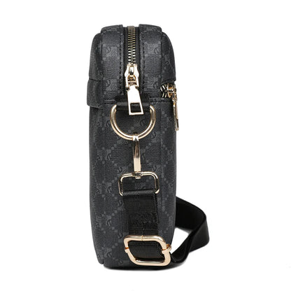 Black patterned bag with gold accents on a white background