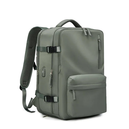 Green backpack with multiple pockets and straps on a white background