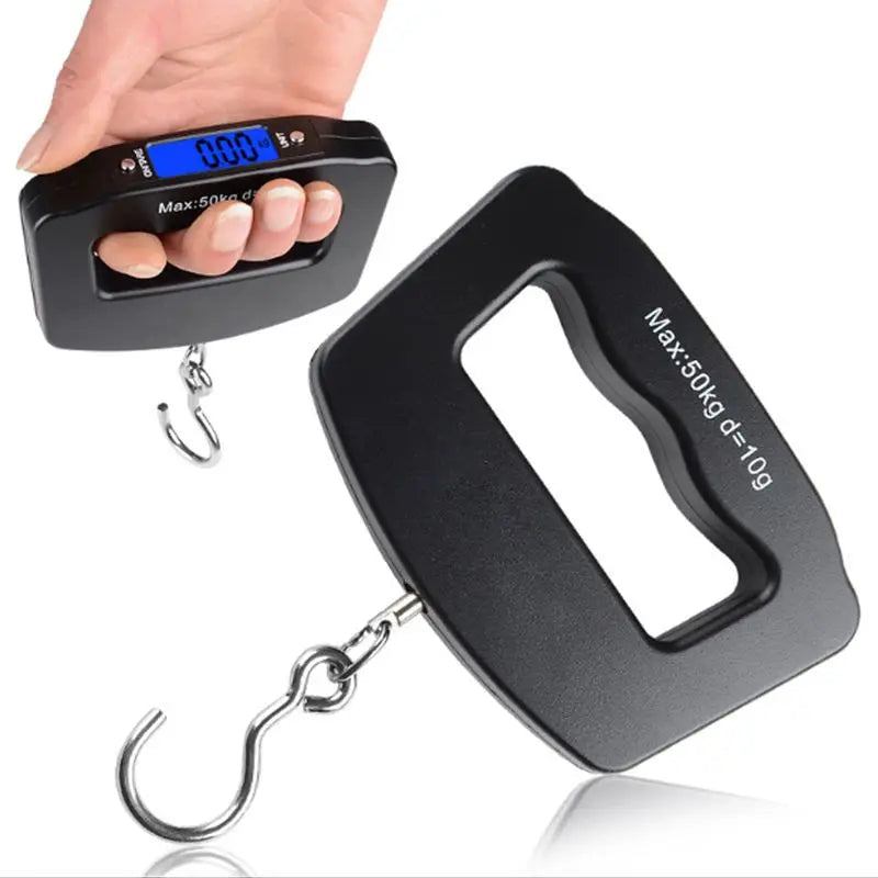 Digital luggage scale with a hand holding it on a white background