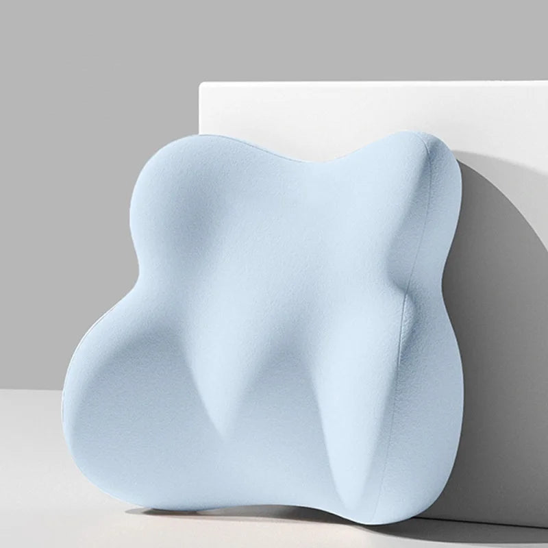 Blue ergonomic pillow on a neutral background