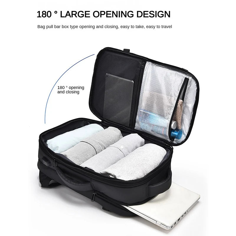 Black travel bag with 180-degree opening design, containing white towels and a blue item, on a white background.