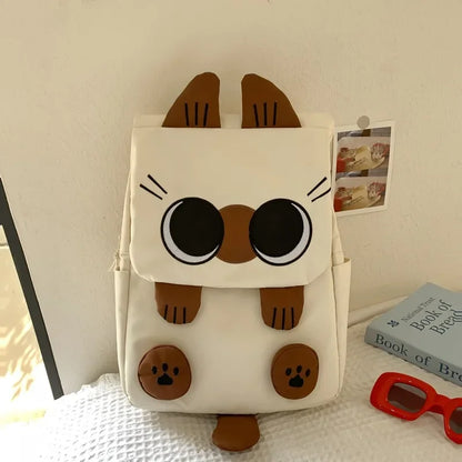 Backpack with cat face design on a white surface