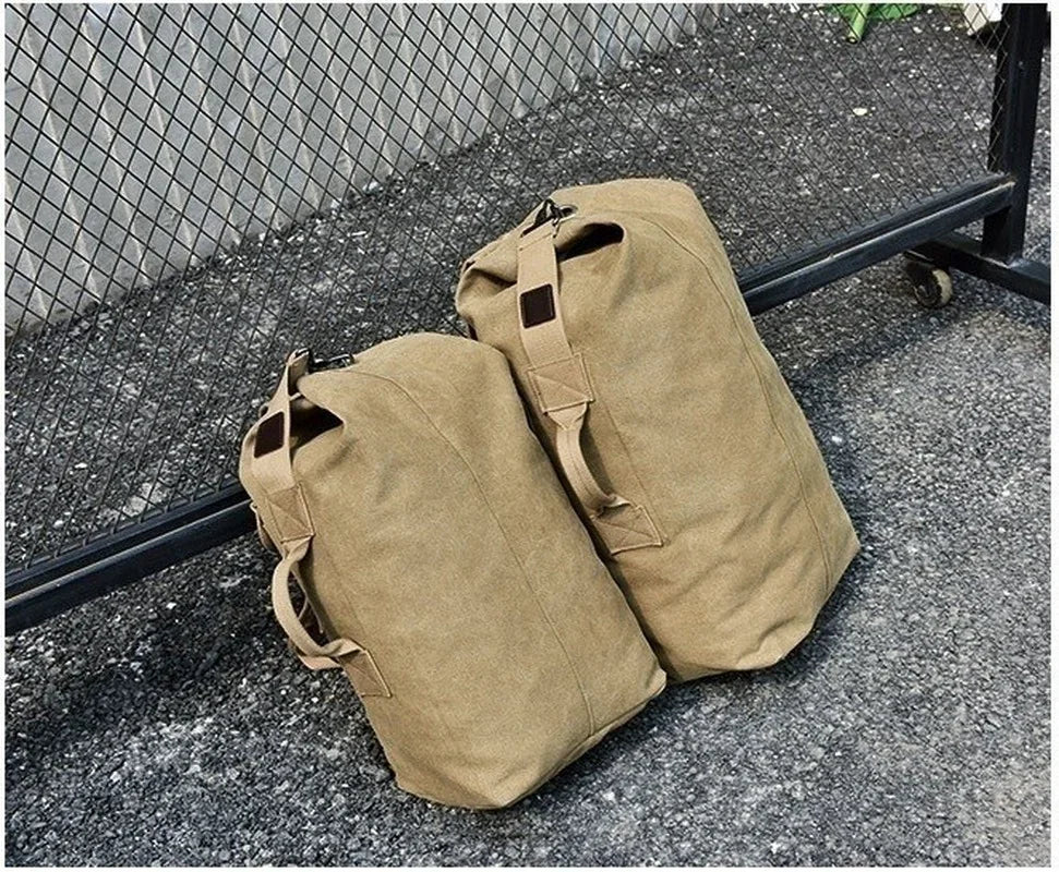 Two tan canvas bags on a concrete surface with a metal grid in the background.