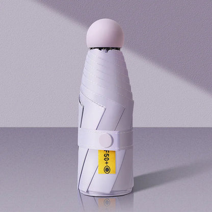 White umbrella with a yellow label on a gray background