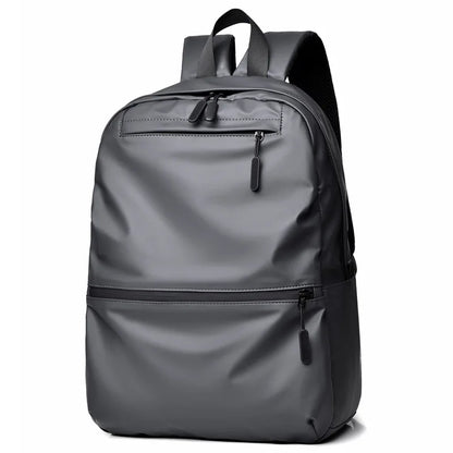Stylish gray waterproof backpack with a large capacity, perfect for students and travelers.