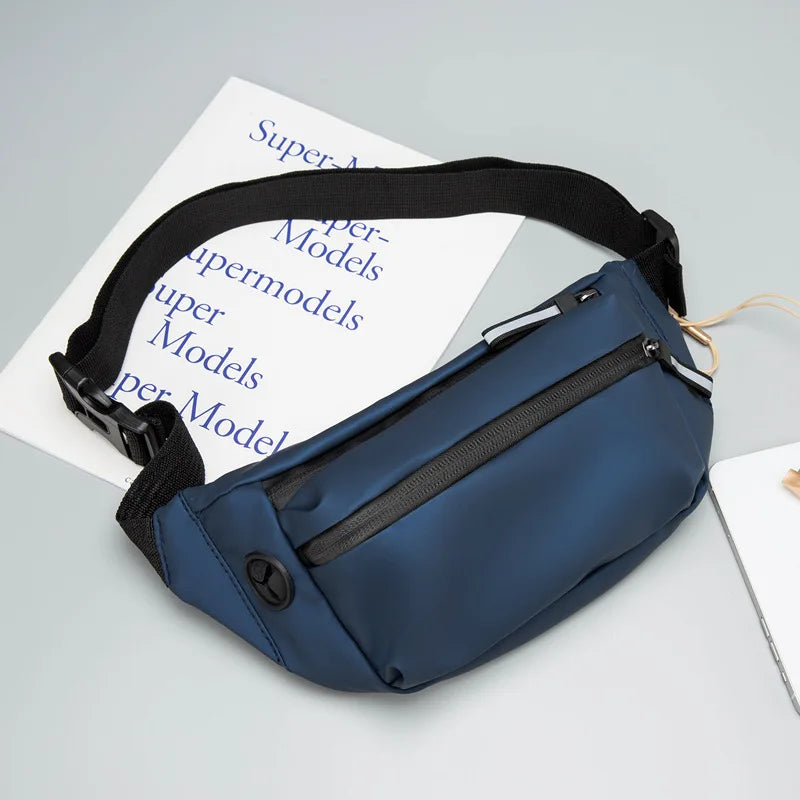 Blue waist bag with black strap on a light gray surface